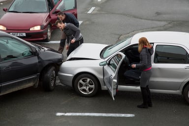 3 cars crashed in an intersection.