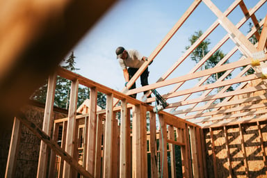 Person building a house