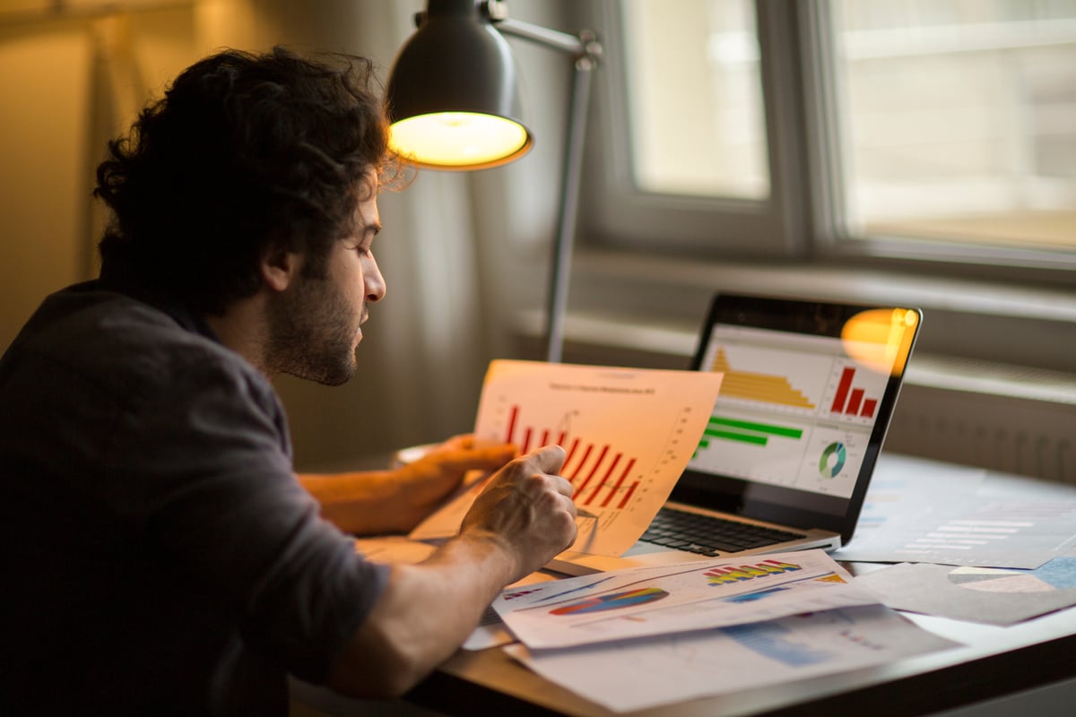 Professional_analyzing_paper_charts