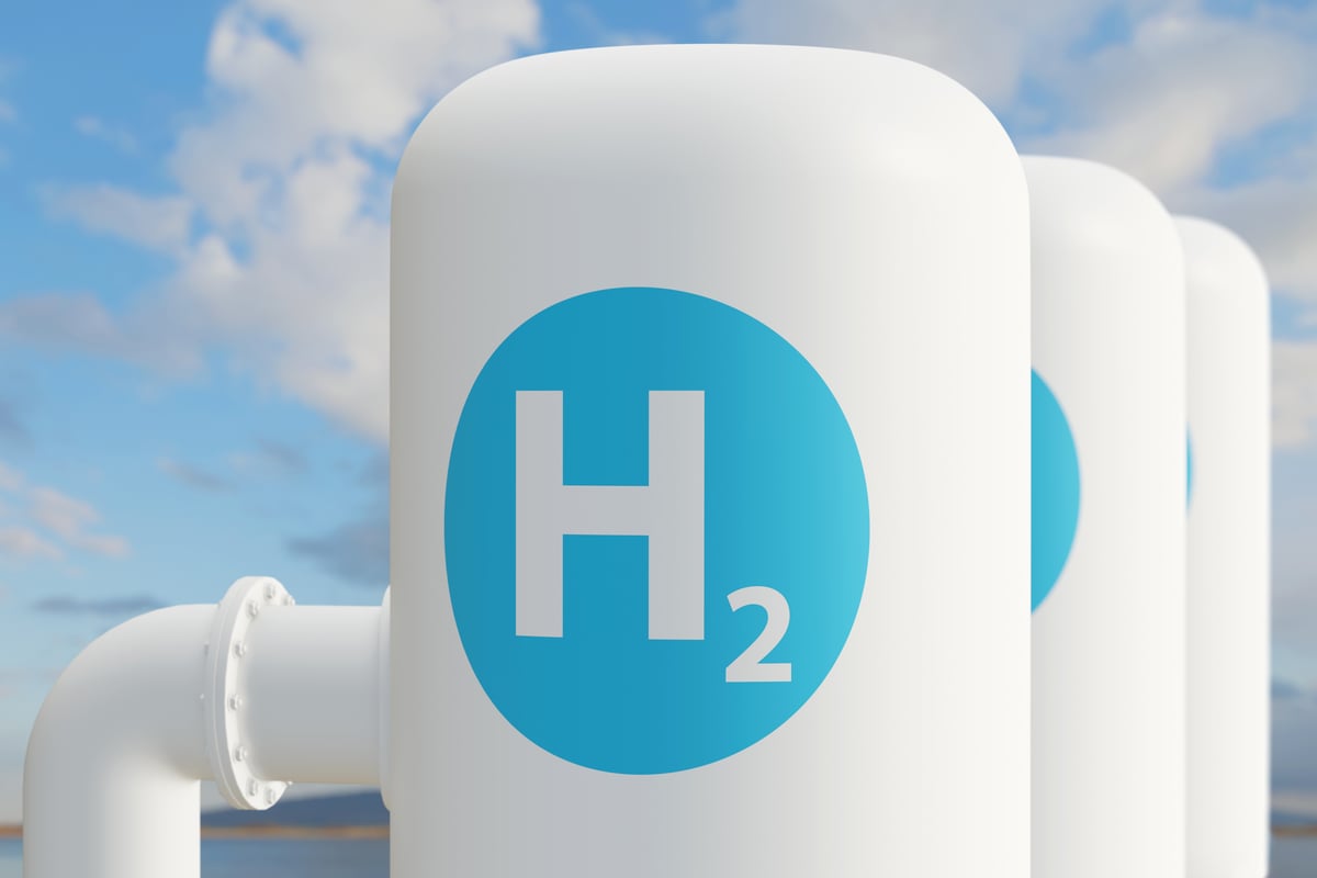 Hydrogen fuel tanks set against a cloudy sky