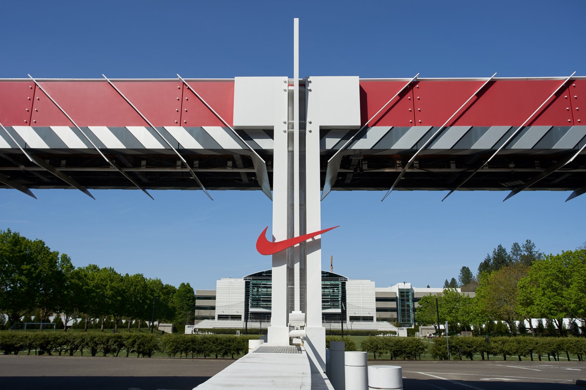 Nike logo in front of a building.