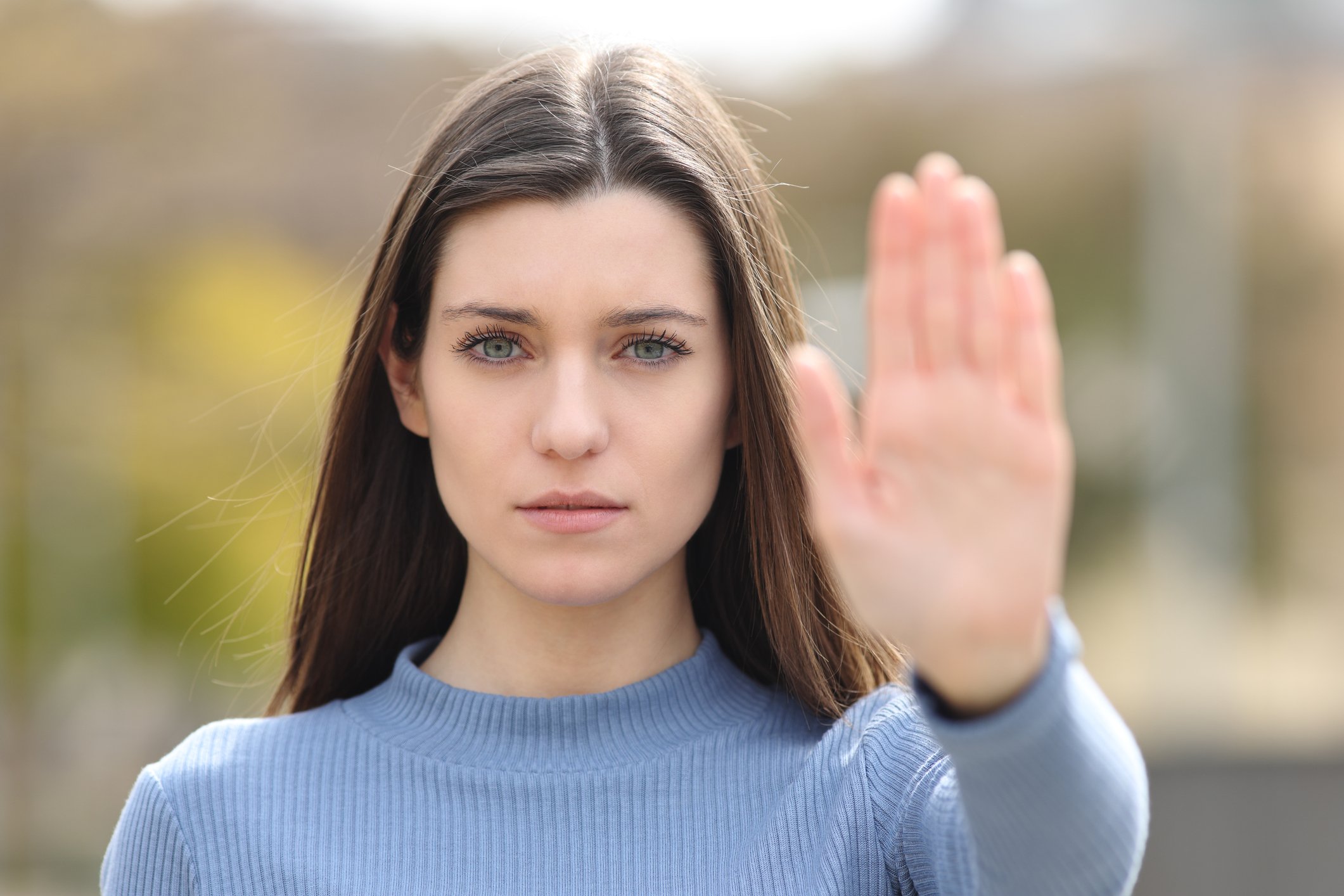 person puts up hand