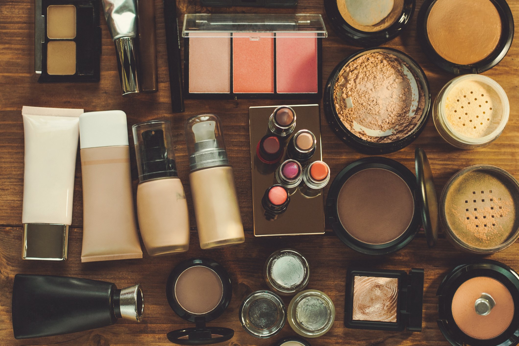 Cosmetics neatly arranged on a desktop.