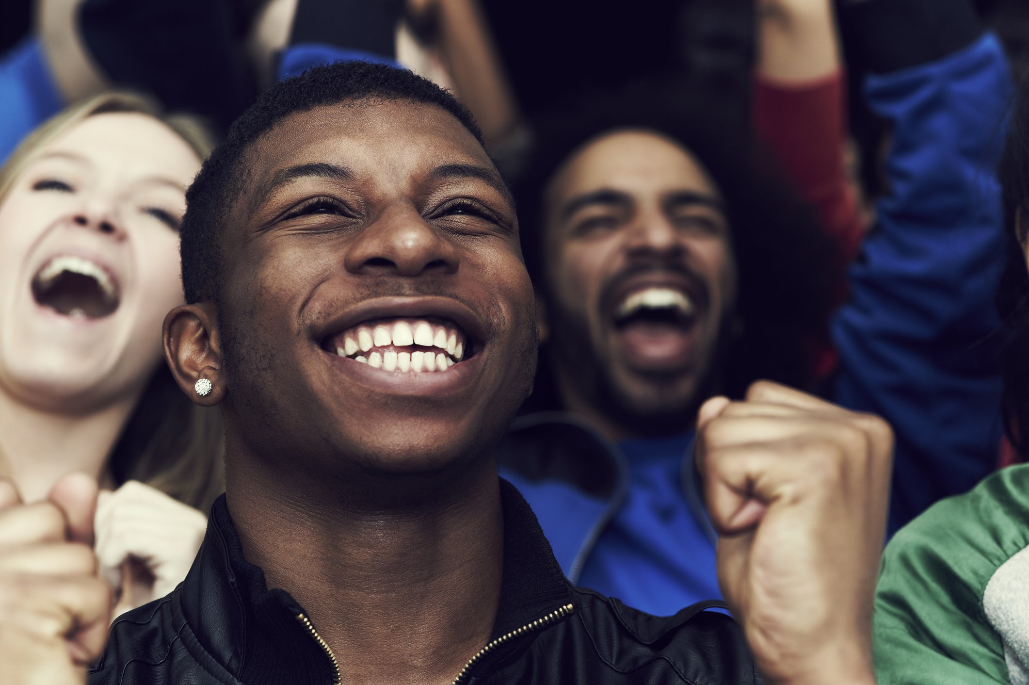 Young people smiling and celebrating.