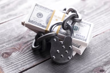 Padlock securing bundle of cash