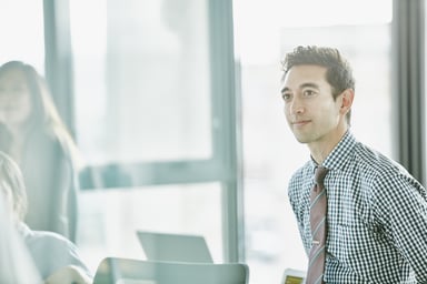 Young man employee in office.