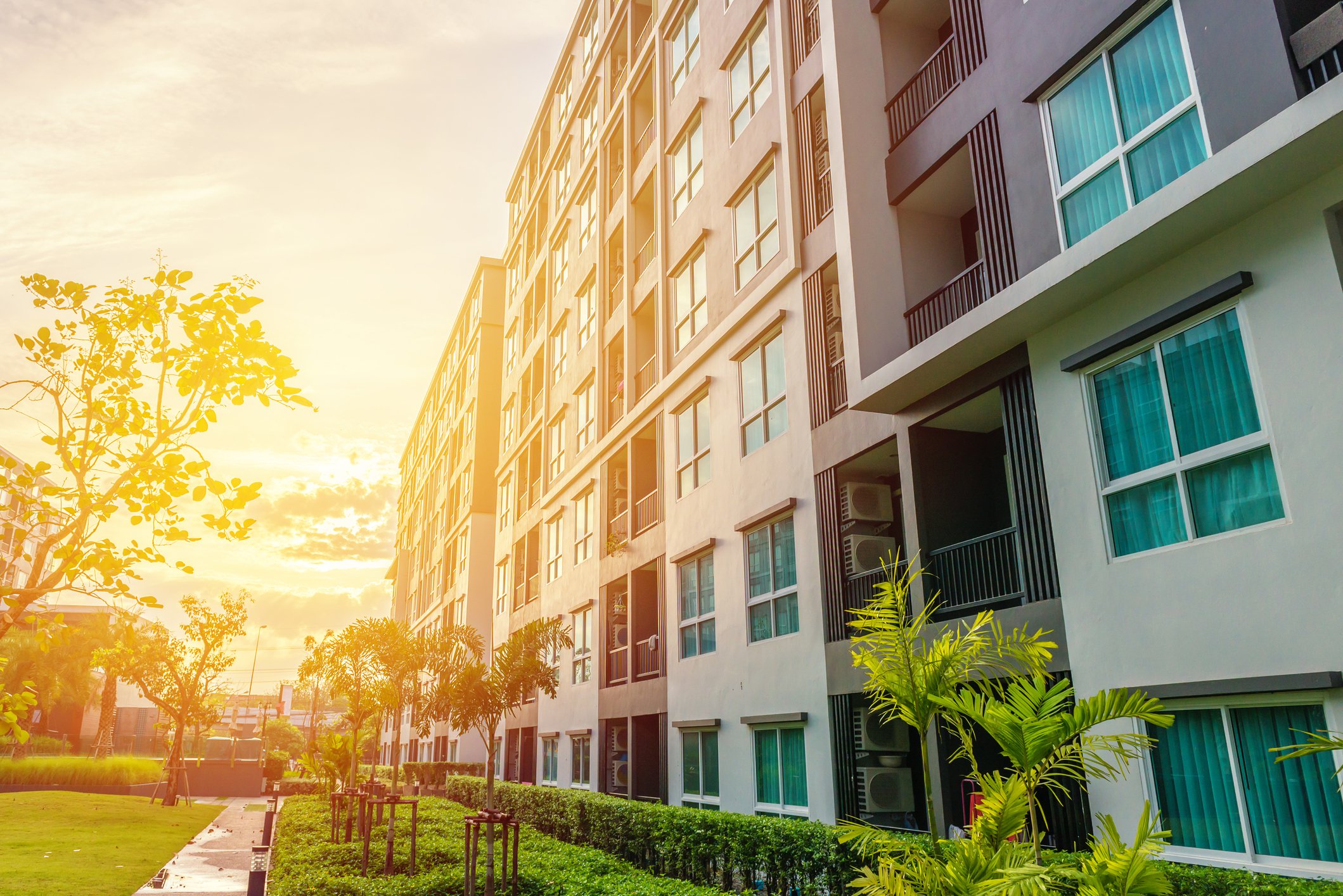A modern apartment complex at dusk.