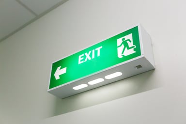 A green exit sign with arrow.