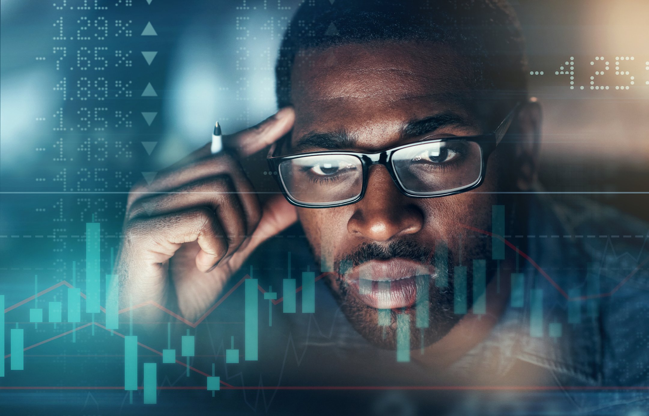 Man-Looking-at-stock-market-evaluating-ETFs