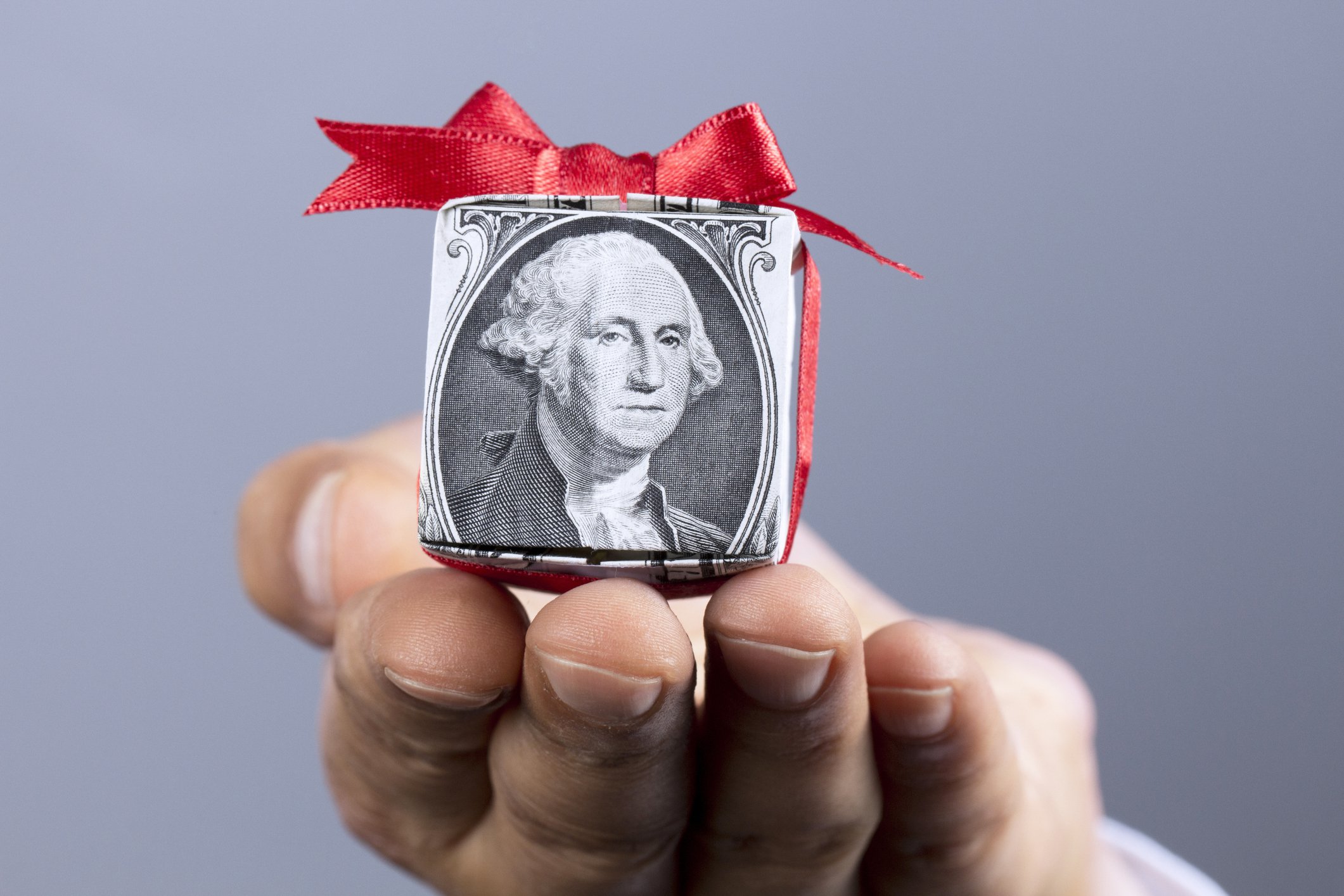 gift made out of a dollar wrapped in bow