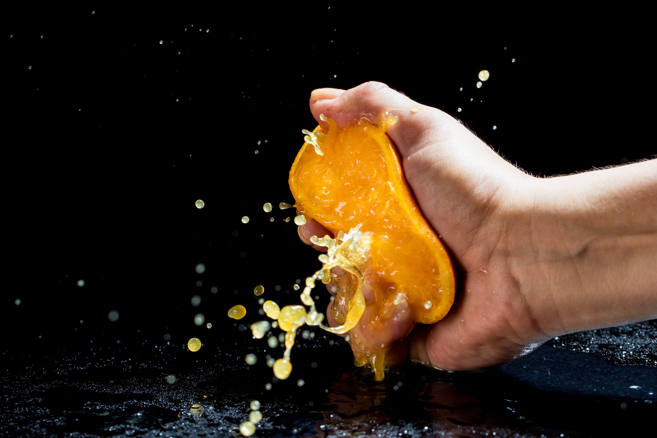 Orange being squeezed