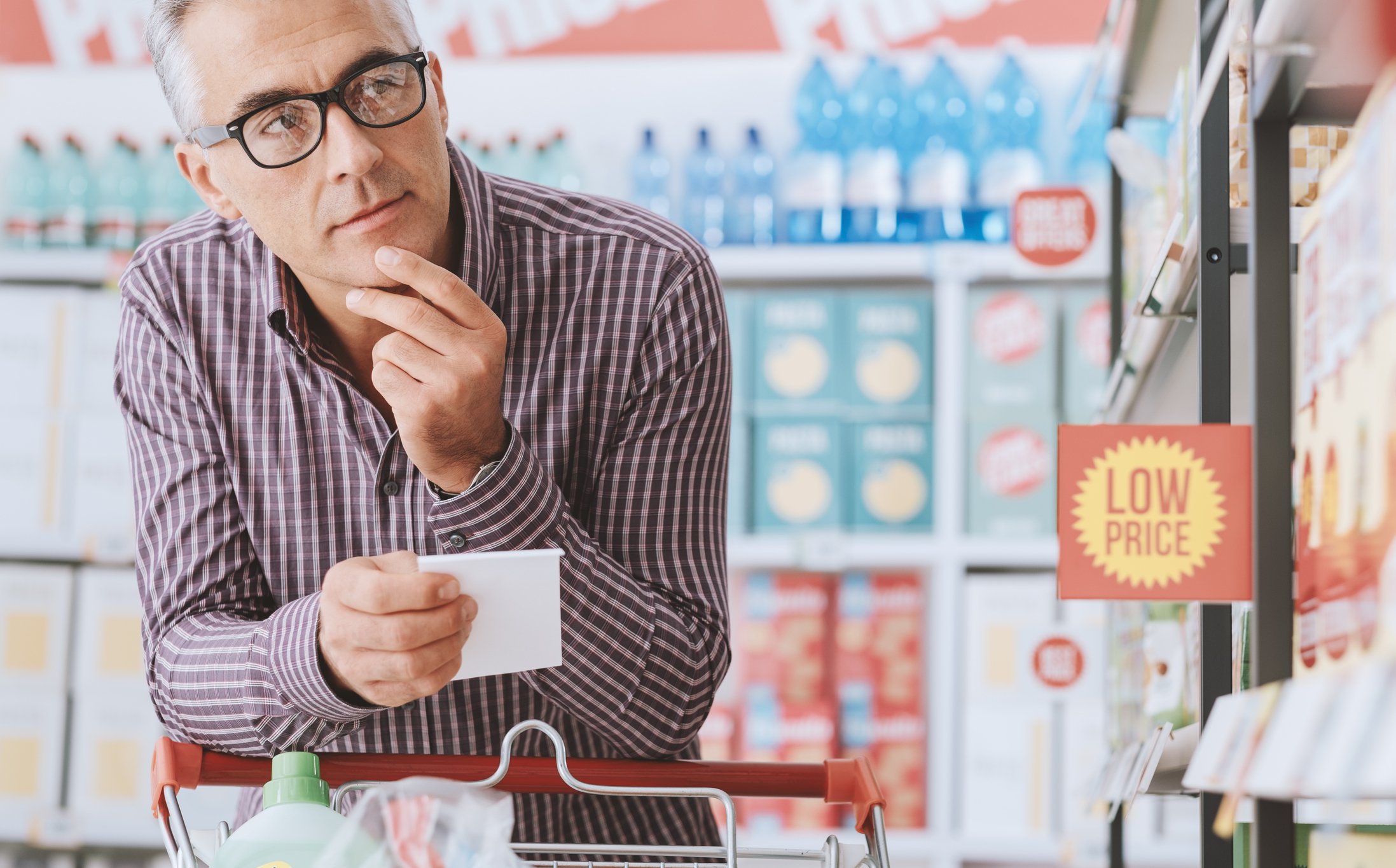 Man shopping with shopping list.