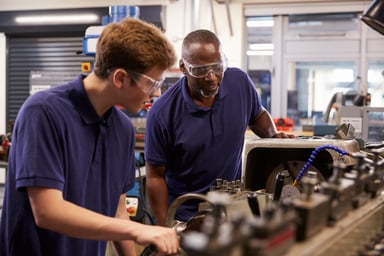 Two men working in a factory.