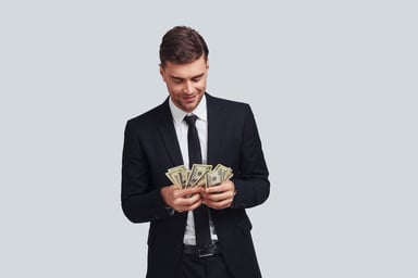 Man in suit counting his money