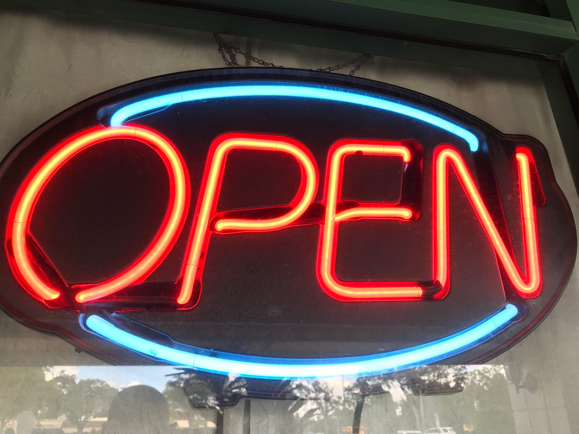 Neon Open sign lit up.