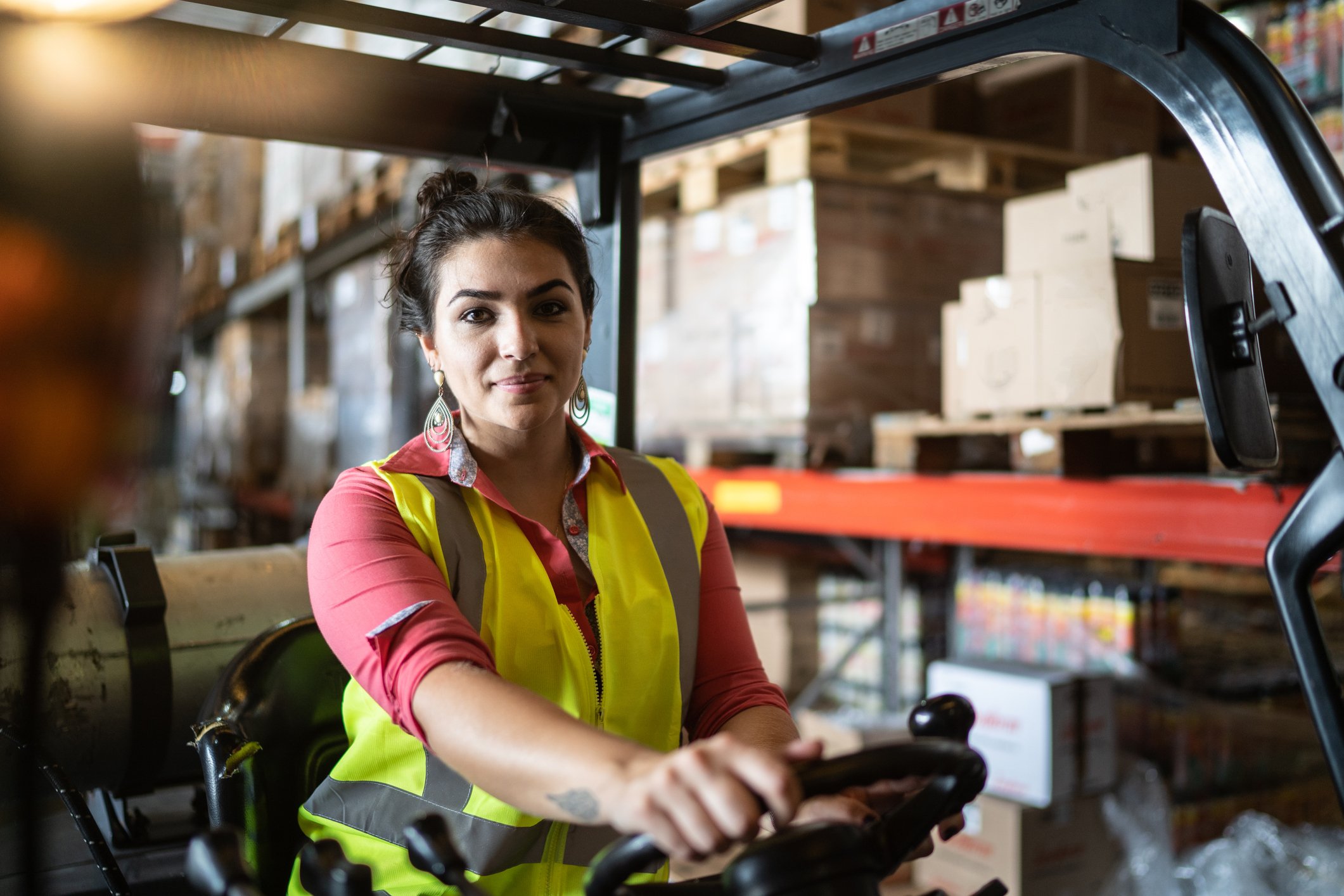 driving a forklift at a factory or warehouse