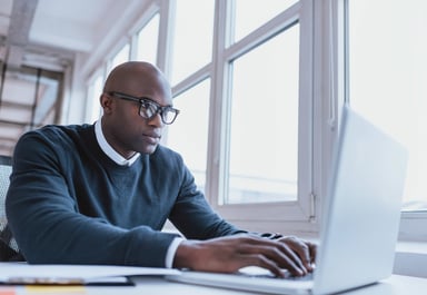 Person typing on a computer.
