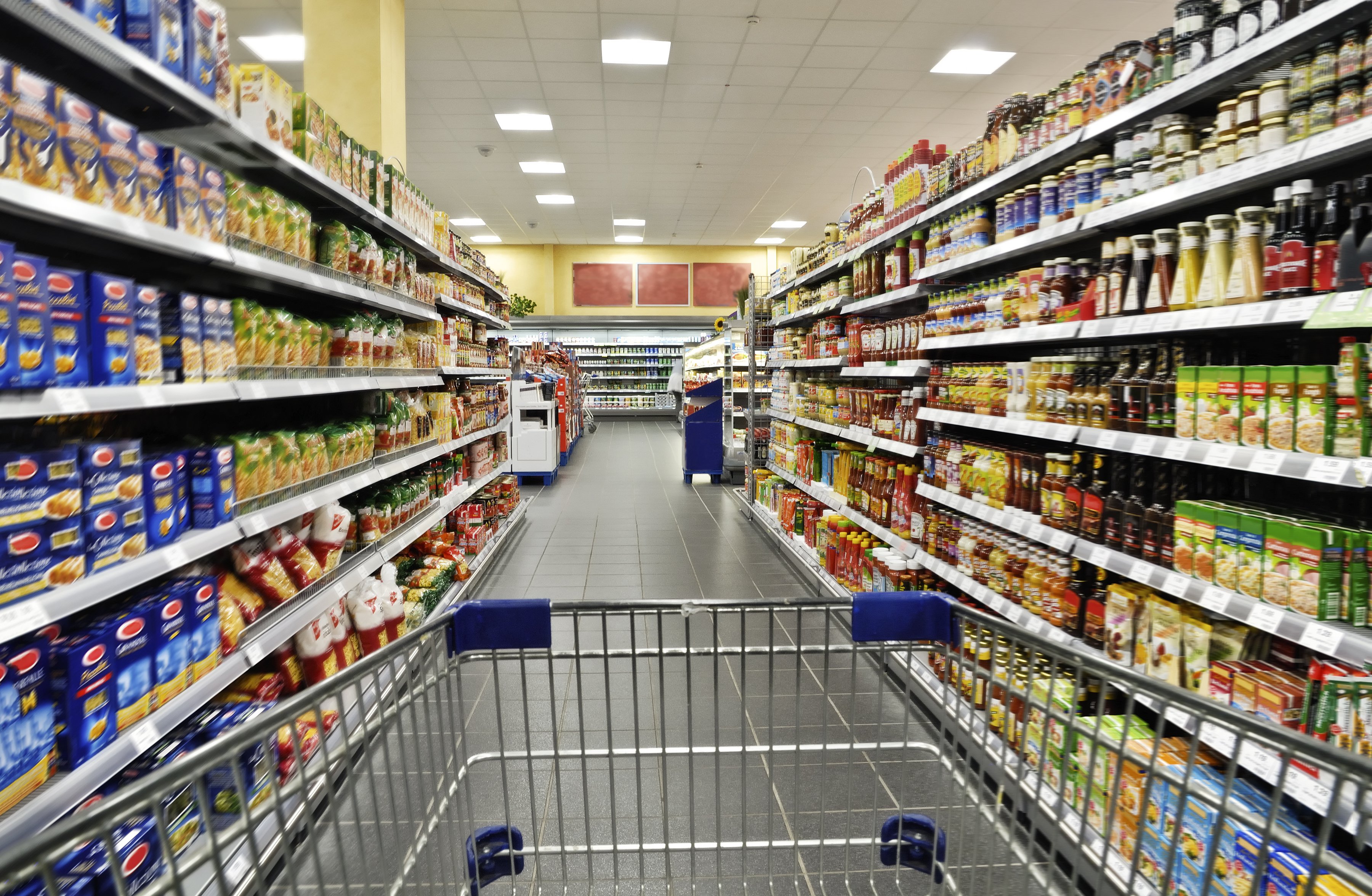 Cart in grocery store aisle