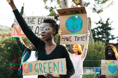 Protesters demonstrating for green energy and environmental causes.