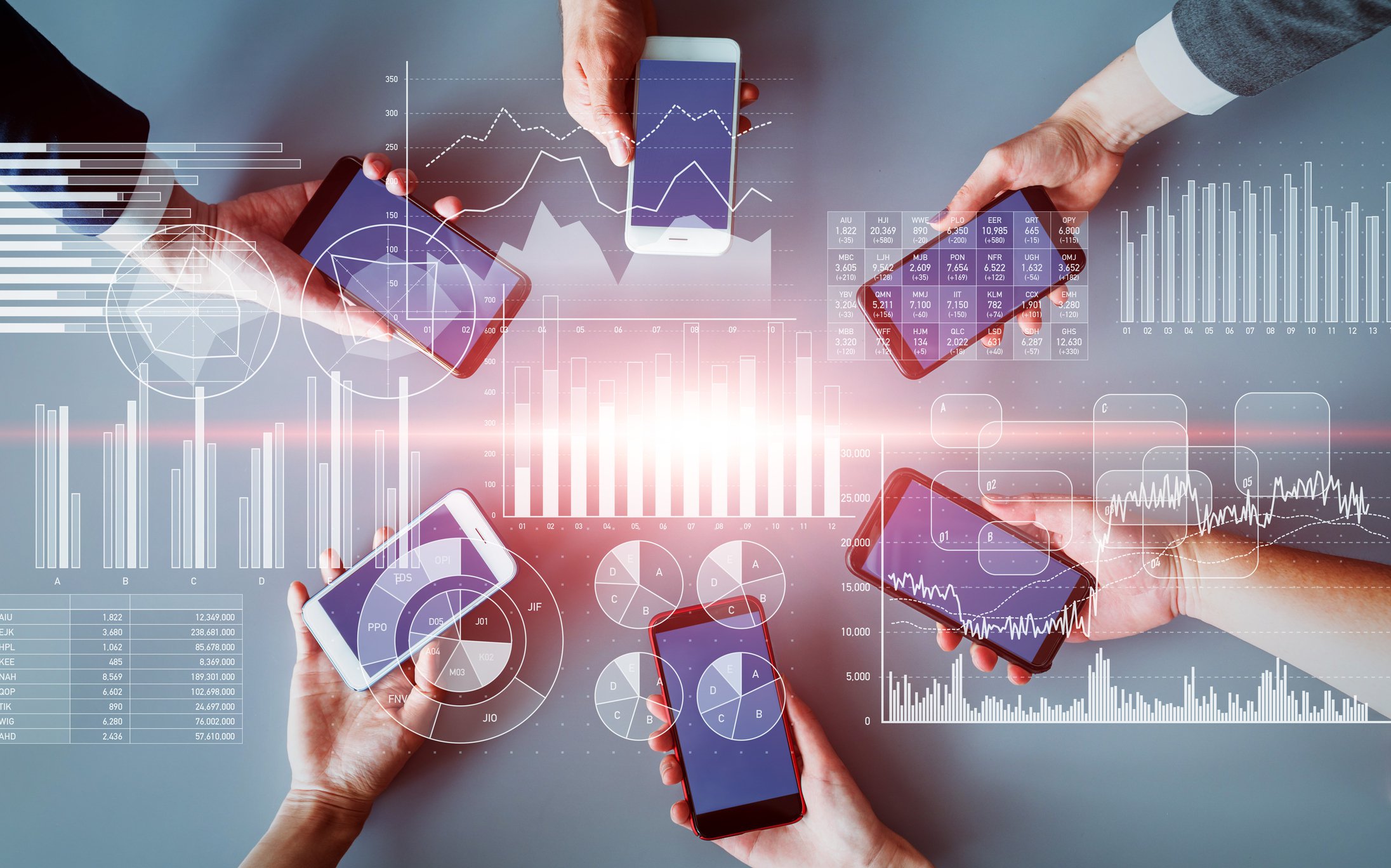 Roundtable of people holding their mobile devices connected by wireless network