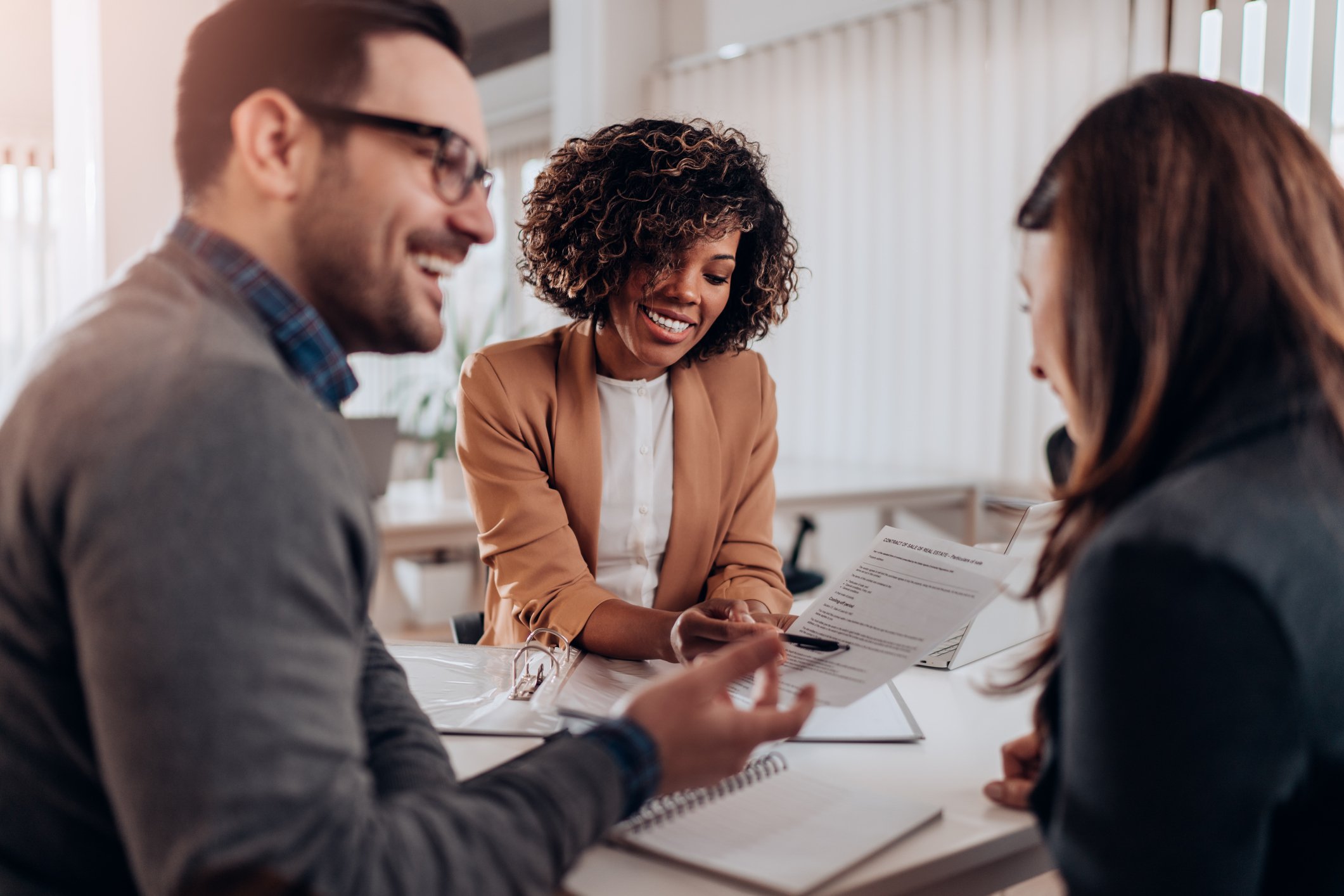 private_reits_three_people_having_a_meeting