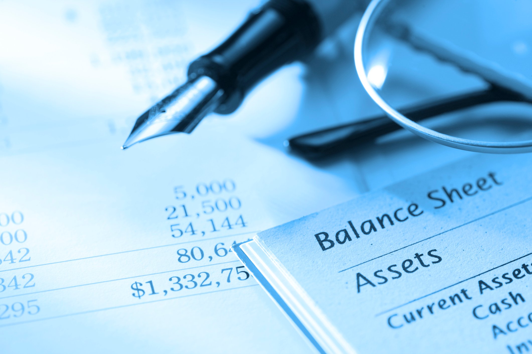 balance sheet with a fountain pen