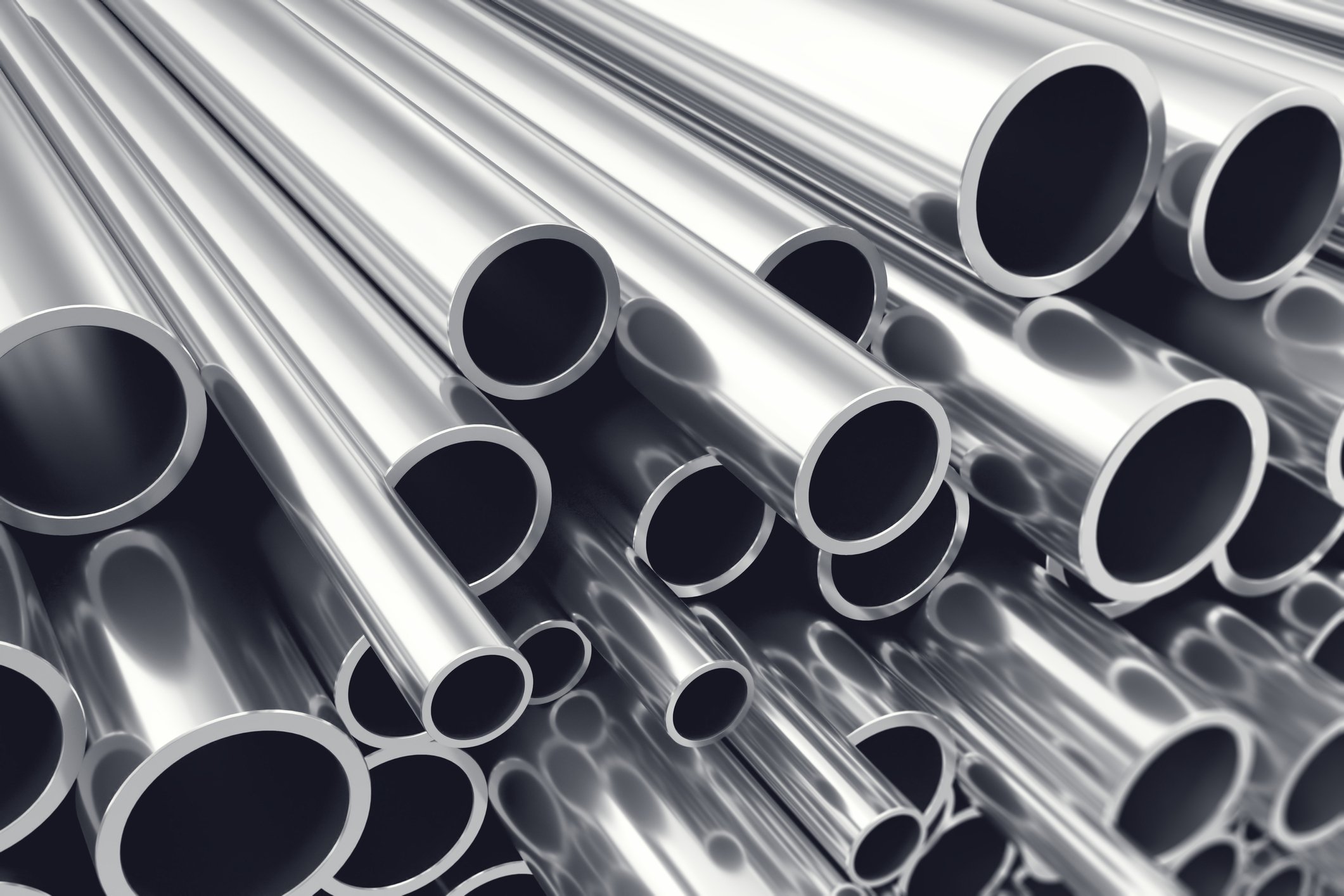 silver metal bars stacked atop one another.jpg