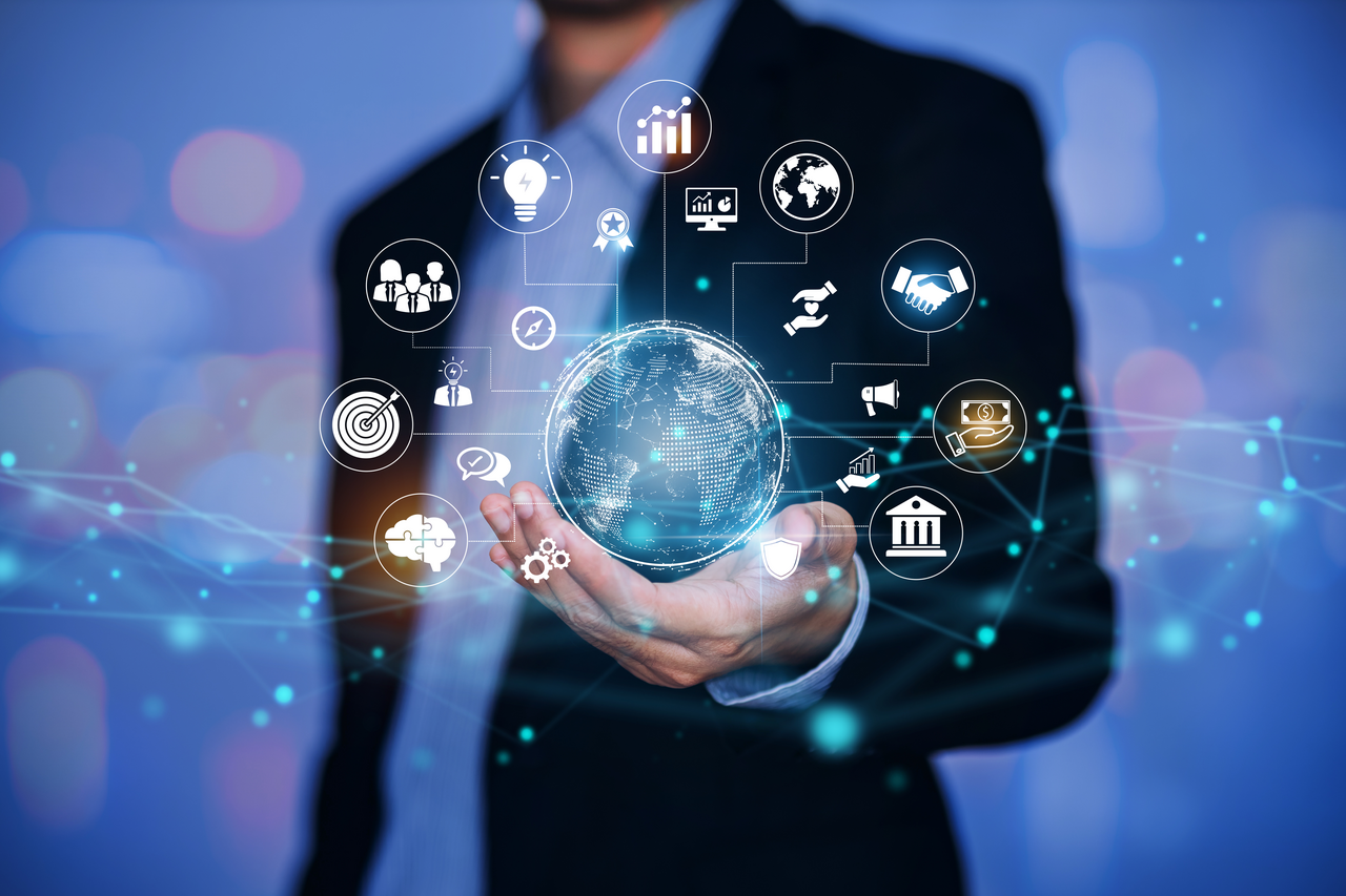 GettyImages-Tech and AI enabling many capabilities as businessman holds digital globe-1407529212-1280x853-757a5e6.png