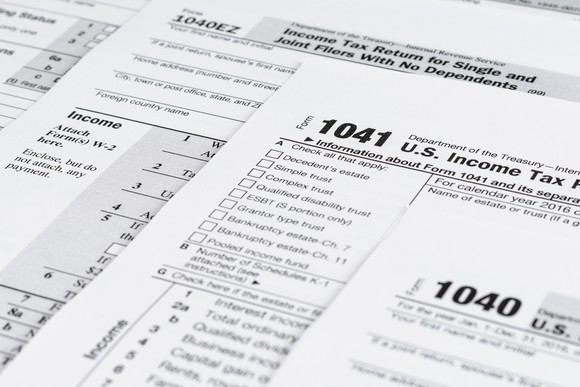 Various tax forms partially covering each other