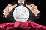 GETTY Fortune teller businessman sees rising market in a crystal ball