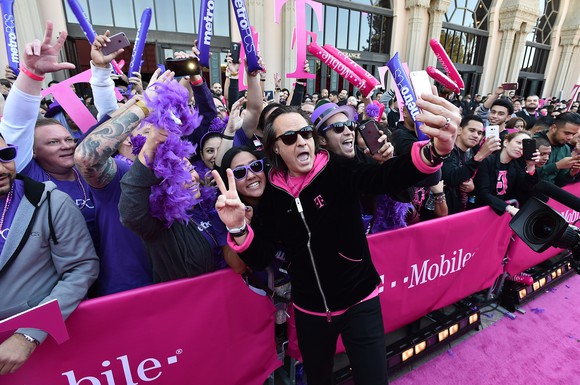 T-Mobile John Legere greets T-Mobile and Metro PCS employees on the “Magenta Carpet” at the Shrine Auditorium in Los Angeles ahead of the Un-carrier X event