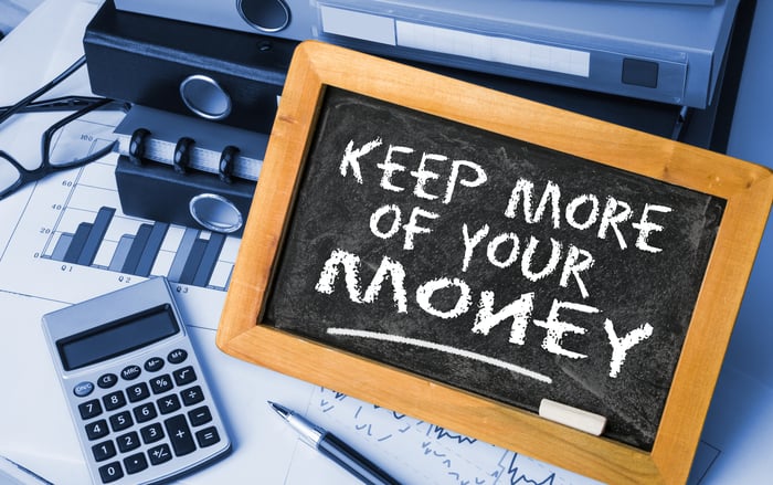 Small blackboard on which is written "Keep more of your money."