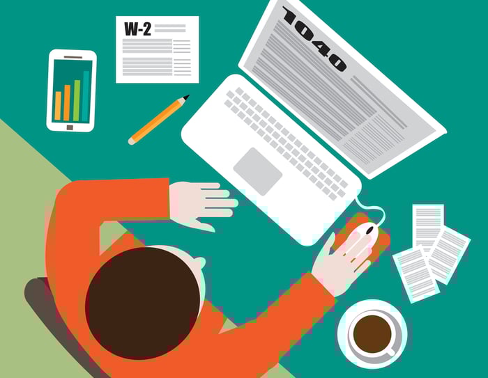 Colorful drawn image of a man seated at laptop filling out tax form 1040.