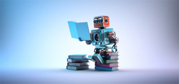 A robot reading a book.