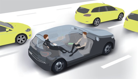 Two passengers sit in a driverless car.