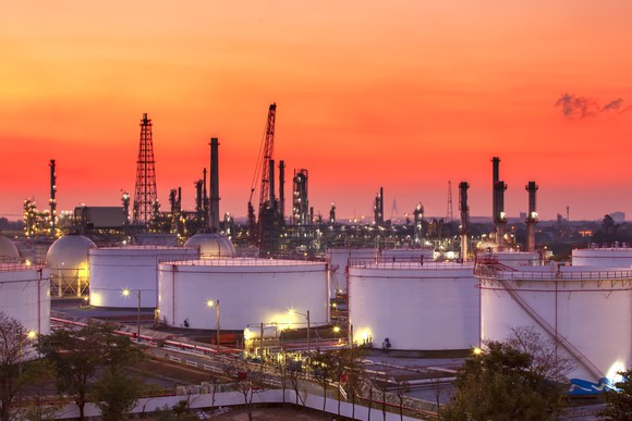 A landscape of a refinery with storage tanks. 