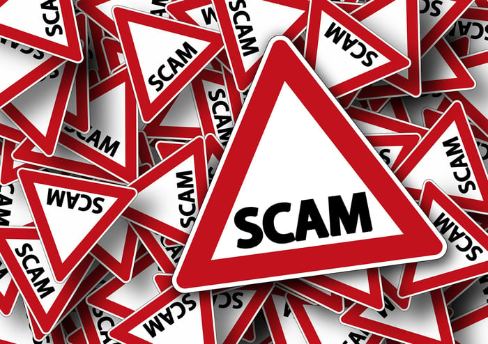 A jumble of red and white triangles, with the word "scam" on each