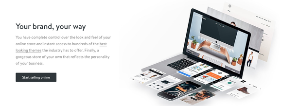 Shopify's homepage, showing a computer with a person's business e-commerce platform on it.