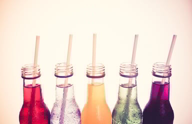 Soda Industry Soda Bottles With Straws Arranged in Row