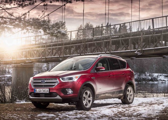 A red Ford Kuga SUV.