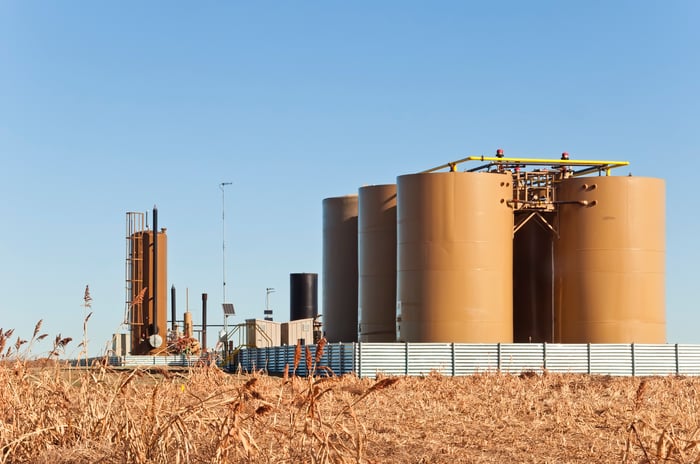 Storage tanks and treater for separating water from crude or condensate from natural gas.