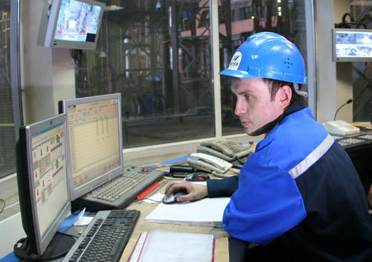 A Mechel PAO employee working in a control room