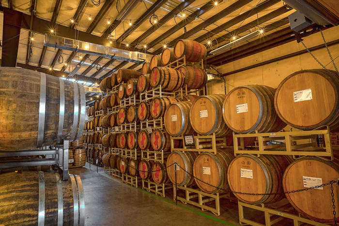 Wicked Weed beer barrels in storage