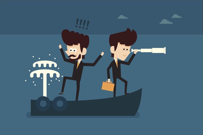 Vector illustration of two businessmen on a leaky boat.