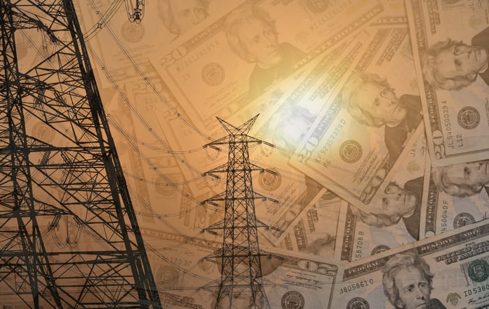 Electric pylon with high power wires and U.S. Dollars.