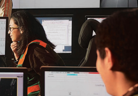 Freeport McMoRan employees working at computers.