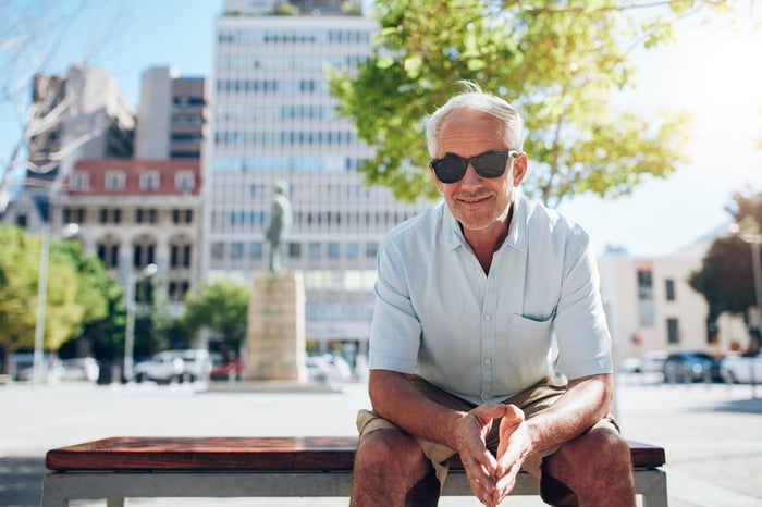 Older man sitting on a bench