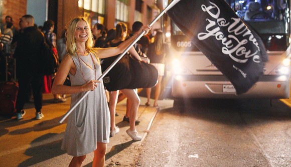 A woman waving a WeWork flag
