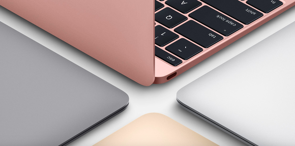 Four Macbook laptops next to each other.