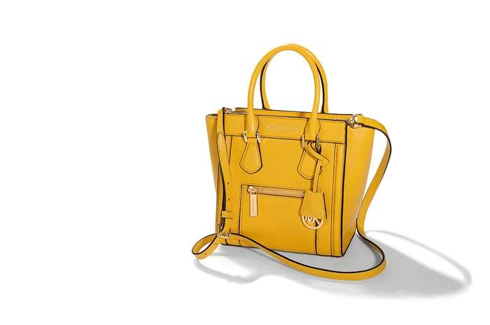 A yellow Michael Kors hand bag.